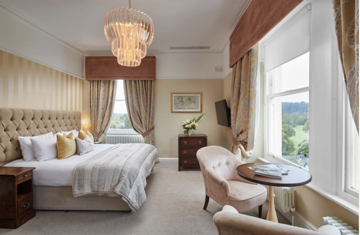 Representative bedroom with lake views at The Belsfield Hotel